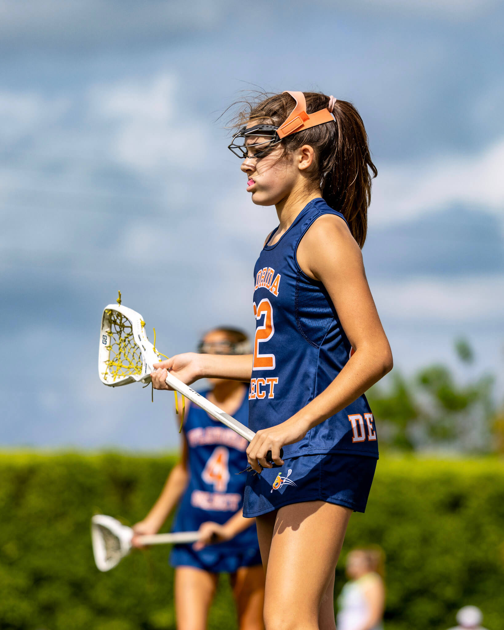 Girls' lacrosse player on the field
