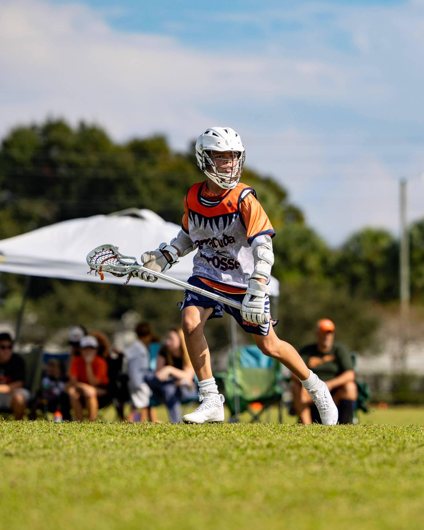 Youth boys' lacrosse player in action